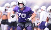 Kansas State junior offensive lineman Gus Hawkins (70) warms up during practice at Kansas State University on Aug. 18, 2026.