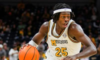 Feb 12, 2025; Columbia, Missouri, USA; Missouri Tigers guard Mark Mitchell (25) dribbles the ball during the first half against the Oklahoma Sooners at Mizzou Arena. Mandatory Credit: Jay Biggerstaff-Imagn Images