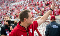 Indiana Head Coach Curt Cignetti holds up the number one to the crowd as he leaves the field after the Indiana versus Wisconson