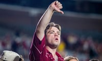 A Florida State fan holds up a thumbs down signal while yelling ìbooî at Florida State Seminoles head coach Mike Norvell after