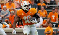Sep 5, 2026; Knoxville, Tennessee, USA;  Tennessee Volunteers running back DeSean Bishop (18) runs the ball against the Furman Paladins during the second half at Neyland Stadium.  Mandatory Credit: Randy Sartin-Imagn Images