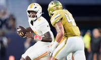 Tennessee quarterback Faizon Brandon (11) runs while defended during a college football game between Tennessee and Georgia Tech at Bobby Dodd Stadium in Atlanta, Ga., on Sept. 12, 2026.