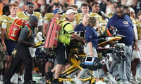 Georgia Tech cornerback Jaylen Mbakwe (3) is taken off the field on a stretcher during a college football game between Tennessee