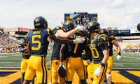 West Virginia celebrates Kedrick Triplett's first touchdown