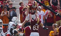 Iowa State's Aiden Flora (21) celebrates with Braden Smith (63) after scoring a touchdown against Bowling Green during the first