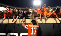 2026-09-20T025841Z_1912408288_MT1USATODAY29868187_RTRMADP_3_OKLAHOMA-STATE-S-DREW-MESTEMAKER-17-HIGH-FIVES-FANS (1)