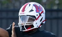 Monroe's Pooty Cunningham throws a pass Friday, Sept. 11 at James Monroe High School.