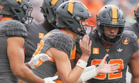 Tennessee quarterback Mason Phillips (13) calls a play during a game between Tennessee and Auburn in Neyland Stadium in Knoxville, Tennessee, Oct. 3, 2026.