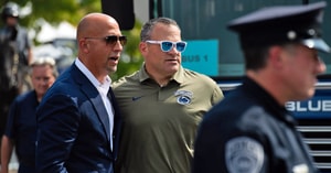 Penn State athletic director Pat Kraft, right, greets head football coach James Franklin outside Beaver Stadium before an NCAA football game against Kent State, Saturday, Sept. 21, 2024, in State College, Pa. (Dan Rainville / USA TODAY NETWORK via Imagn Images)