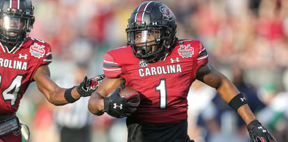 South Carolina safety DQ Smith returns an interception against Notre Dame in the Gator Bowl