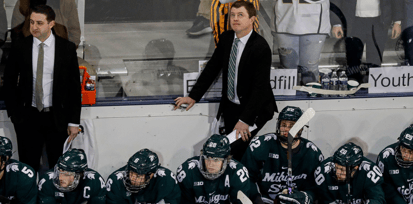 Michigan state head coach Adam Nightingale watches a replay against Michigan during the second period at Yost Ice Arena in Ann Arbor on Friday, Feb. 9, 2024 - Junfu Han, USA TODAY Sports