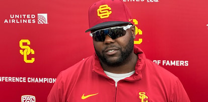 USC defensive line coach Eric Henderson speaks to the media following a spring ball practice with the Trojans