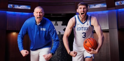 Kentucky coach Mark Pope poses with new commit Andrew Carr - UK Athletics