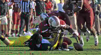 South Carolina football legend Jadeveon Clowney's "The Hit" vs. Michigan. Photo credit: Al Messerschmidt/Getty Images