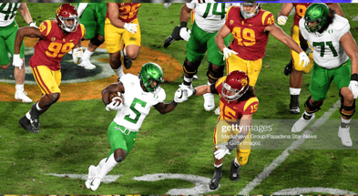 Los Angeles, CA - December 18: Running back Sean Dollars #5 of the Oregon Ducks runs for a first down against the USC Trojans in the first half of the PAC 12 Championship football game at the Los Angeles Memorial Coliseum in Los Angeles on Friday, Decembe