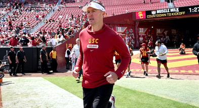 Head coach Lincoln Riley of the USC Trojans runs onto the field for the spring football game at the Los Angeles Memorial Coliseum on April 15, 2023 in Los Angeles, California