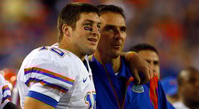 Former Florida coach Urban Meyer and Tim Tebow