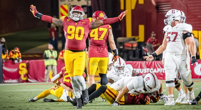 USC defensive lineman Bear Alexander celebrates a defensive play by the Trojans against Stanford