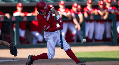 Sophomore infielder Dylan Carey hits one of his two home runs on Friday. (Photo Credit: Nebraska Athletic Communications)