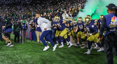 Marcus Freeman with Notre Dame team