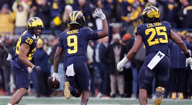 Nov 25, 2023; Ann Arbor, Michigan, USA; Michigan Wolverines defensive back Rod Moore (9) celebrates after he makes an interception in the second half against the Ohio State Buckeyes at Michigan Stadium. Mandatory Credit: Rick Osentoski-USA TODAY Sports