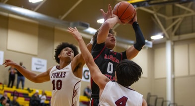 USC signee and Harvard-Westlake's Trent Perry jumps up as Koa Peat and Jonas Cederlind try to block him at Hoophall final at Chaparral High School gym