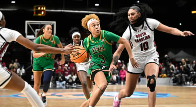 Notre Dame Fighting Irish guard Hannah Hidalgo (3) drives against South Carolina Gamecocks center Kamilla Cardoso (10) in a women's college basketball game at Halles Georges Arena.