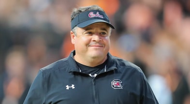 South Carolina football offensive coordinator Dowell Loggains smiles before a game (Photo Credit: CJ Driggers | GamecockCentral.com)(