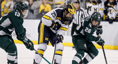 Michigan left wing Dylan Duke is defended by Michigan State right wing Tanner Kelly during the third period at Yost Ice Arena in Ann Arbor on Friday, Feb. 9, 2024 - Junfu Han, USA TODAY Sports