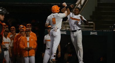Christian Moore and Dylan Dreiling of Tennessee baseball celebrating a big inning. Credit: UT Athletics