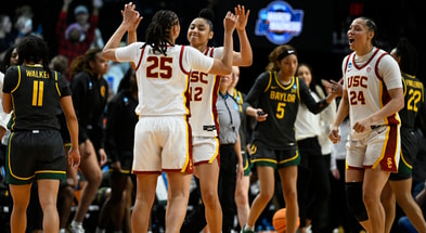 USC Trojans guard JuJu Watkins (12) celebrates with guard McKenzie Forbes (25) and forward Kaitlyn Davis (24) after a game against the Baylor Lady Bears in the semifinals of the Portland Regional of the 2024 NCAA Tournament at the Moda Center