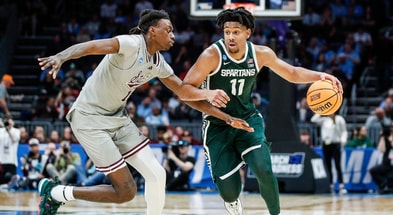 Michigan State guard A.J. Hoggard (11) dribbles against Mississippi State forward KeShawn Murphy (12) during the second half of NCAA tournament West Region first round at Spectrum Center in Charlotte, N.C. - Junfu Han, USA TODAY Sports