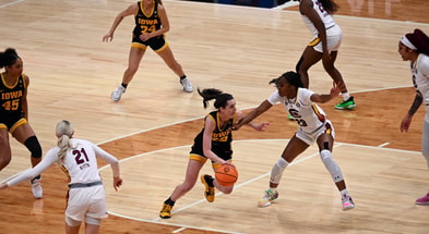 Caitlin Clark drives to the basket against South Carolina in the national title game. (Photo by Dennis Scheidt)