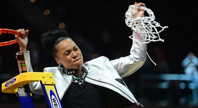 South Carolina Gamecocks head coach Dawn Staley cuts the net after defeating the Iowa Hawkeyes in the finals of the Final Four of the womens 2024 NCAA Tournament at Rocket Mortgage FieldHouse. Mandatory Credit: Ken Blaze-USA TODAY Sports