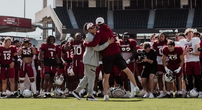 Dawn Staley visits a South Carolina football practice in the spring of 2024 (Photo Credit: Gamecock Football | X)