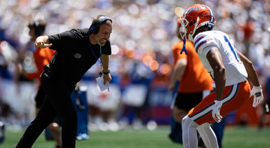 Florida Gators head coach Billy Napier celebrates with Florida Gators wide receiver Aidan Mizell (11) after a touchdown during the first half at the Orange and Blue spring football game at Steve Spurrier Field at Ben Hill Griffin Stadium in Gainesville, FL on Saturday, April 13, 2024. [Matt Pendleton/Gainesville Sun]