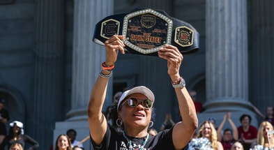 South Carolina basketball coach Dawn Staley holds up a championship belt during Sunday's national title parade (Photo: Katie Dugan | GamecockCentral.com)