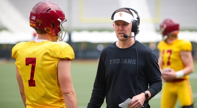 USC head coach Lincoln Riley speaks to quarterback Miller Moss during the Trojans' 2024 spring game