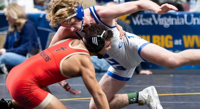 Conwell-Egan's Charlie Robson (right) wrestles to a 4-2 decision over Bishop McCourt's Mason Gibson during the 133-pound third place bout at the PIAA Class 2A Wrestling Championships at the Giant Center on March 9, 2024, in Hershey. Dan Rainville / USA TODAY NETWORK