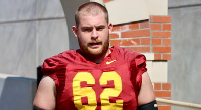 USC offensive lineman Cooper Lovelace walks out for a practice with the Trojans