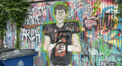 A since painted-over mural of Arch Manning on Austin's east side