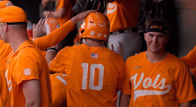 Tennessee catcher Cal Stark celebrates with teammate after scoring a run against Vanderbilt. Credit: Caleb Griffin (UT Athletics)