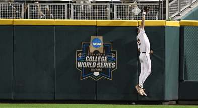 Jun 15, 2024; Omaha, NE, USA; Texas A&M Aggies right fielder Jace Laviolette (17) makes a catch against the wall against the Florida Gators during the ninth inning at Charles Schwab Field Omaha. Mandatory Credit: Steven Branscombe-USA TODAY Sports