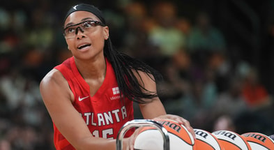 Atlanta Dream guard Allisha Gray gathers a ball during the WNBA All-Star Game 3-point contest at Footprint Center on Friday, July 19, 2024. (© Joe Rondone/The Republic / USA TODAY NETWORK)