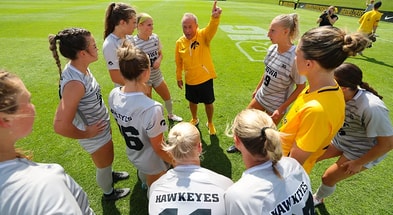 Coach Dave Dilanni speaks to his team before a game against Illinois. (Photo by Stephen Mally/UI Athletics)