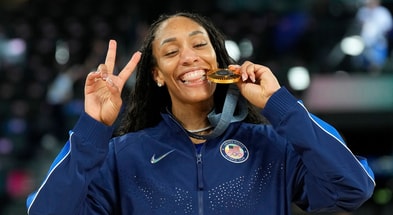 A'Ja Wilson (9) celebrates with the gold medal after defeating France in the women's gold medal game during the Paris 2024 Olympic Summer Games at Accor Arena. Mandatory Credit: Kyle Terada-USA TODAY Sports