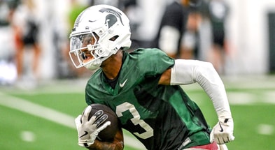 Michigan State's Montorie Foster Jr. runs after a catch during camp on Monday, Aug. 5, 2024, at the indoor practice facility in East Lansing - Nick King, USA TODAY Sports