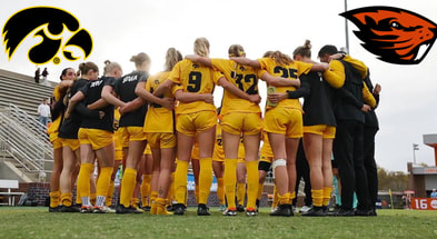 Iowa soccer huddles before a game against Georgia in the NCAA Tournament. (Photo by Stephen Mally/UI Athletics)