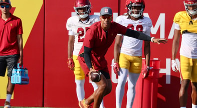 USC assistant defensive backs coach Taylor Mays runs a drill during a fall camp practice with the Trojans