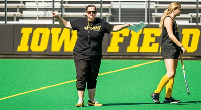 Head Coach Lisa Cellucci instructs her team during a practice at Grant Field. (Photo by Dennis Scheidt)